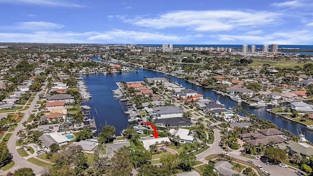 birds eye view of property featuring a water view and a residential view