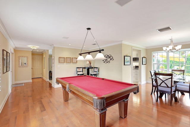 rec room with visible vents, ornamental molding, and light wood finished floors