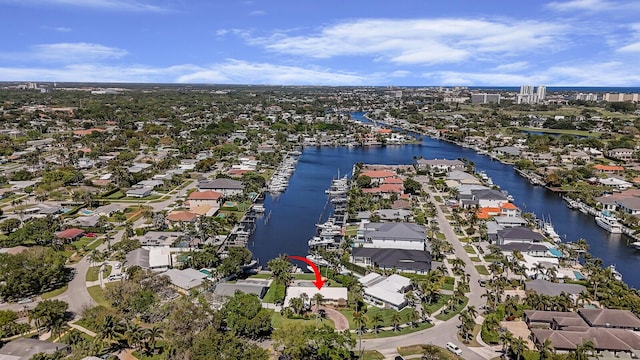 birds eye view of property with a water view and a residential view