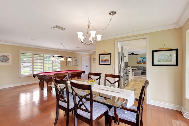 dining space with visible vents, light wood-style flooring, billiards, crown molding, and baseboards