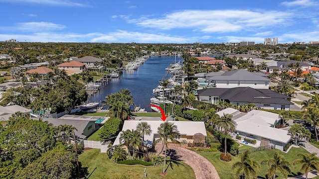 drone / aerial view featuring a water view and a residential view