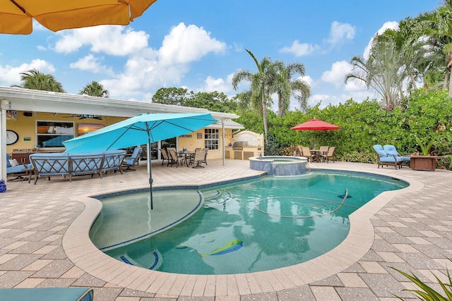 view of pool with an outdoor living space, outdoor dining area, a patio area, and a pool with connected hot tub