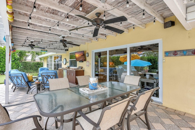 view of patio / terrace with ceiling fan and outdoor dining space