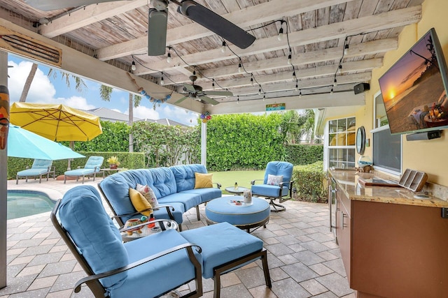 view of patio / terrace with area for grilling, an outdoor living space, and ceiling fan