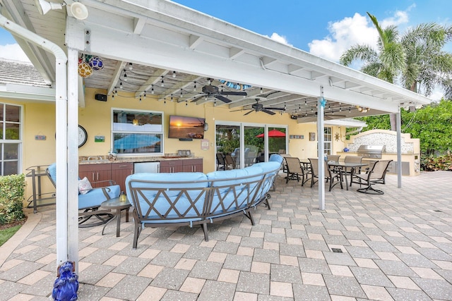 view of patio featuring ceiling fan, an outdoor hangout area, area for grilling, and outdoor dining space