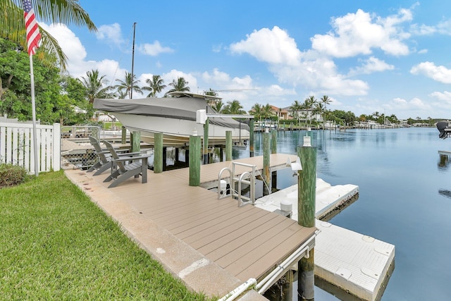 dock area with a water view and boat lift