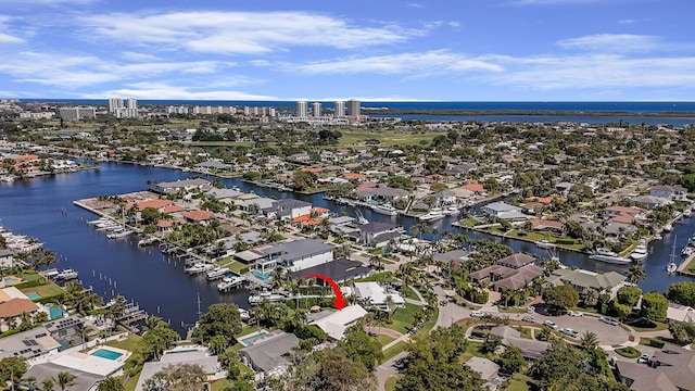 birds eye view of property with a residential view and a water view