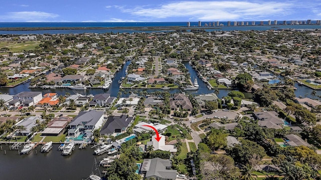 bird's eye view with a residential view and a water view