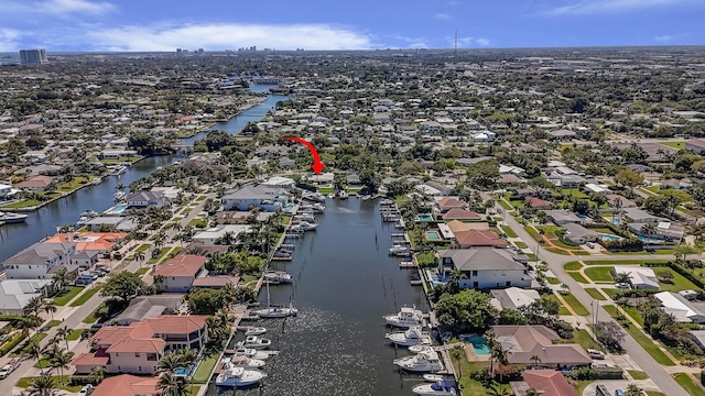 drone / aerial view with a residential view and a water view