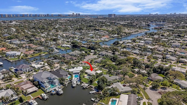 birds eye view of property with a residential view and a water view