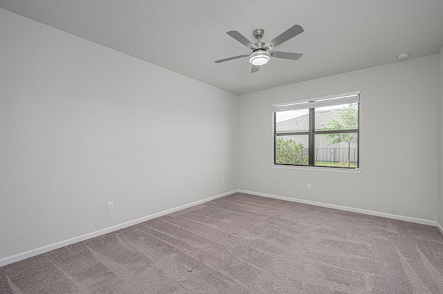 unfurnished room featuring carpet flooring and ceiling fan