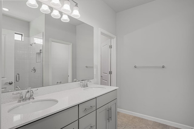 bathroom featuring vanity, tile patterned floors, and walk in shower