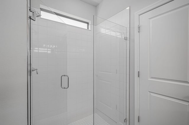 bathroom featuring an enclosed shower