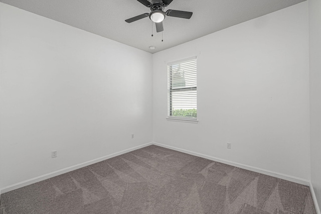 empty room with carpet flooring and ceiling fan