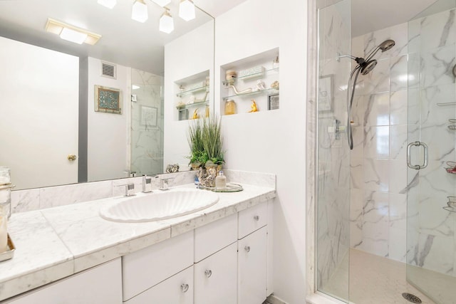 laundry area with cabinets, light hardwood / wood-style floors, washing machine and dryer, and a textured ceiling