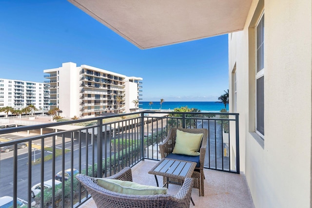 balcony featuring a water view