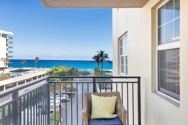 view of swimming pool with a patio area and a water view