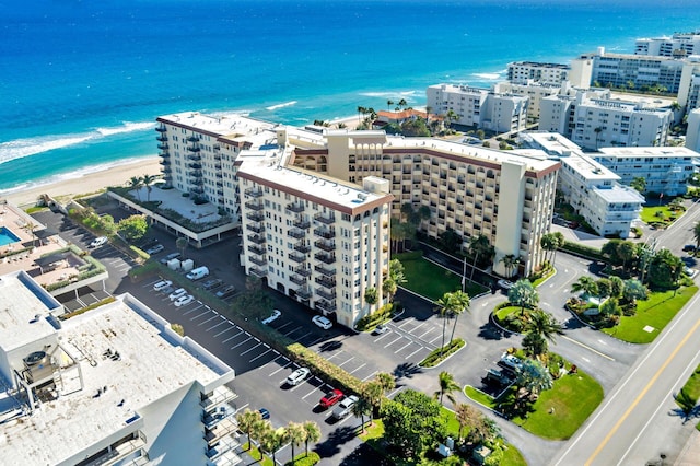 drone / aerial view with a view of the beach and a water view