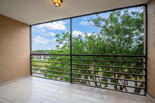 unfurnished sunroom with a wealth of natural light