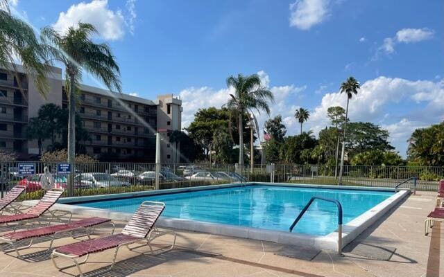 view of swimming pool with a patio area