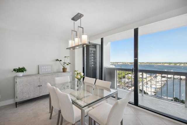 tiled dining area with a water view