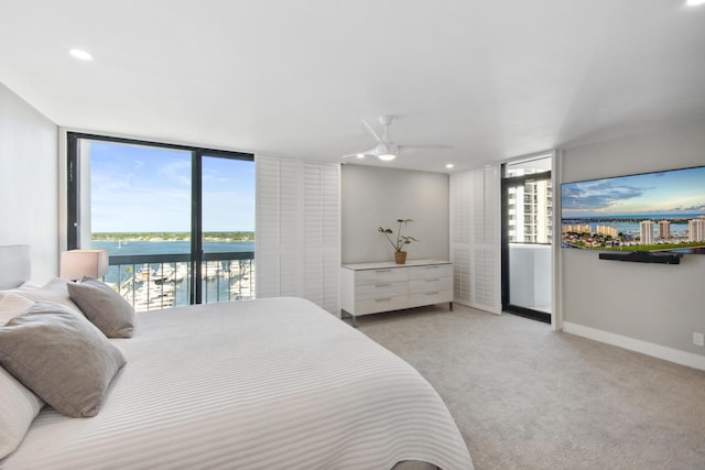 carpeted bedroom with access to exterior and ceiling fan