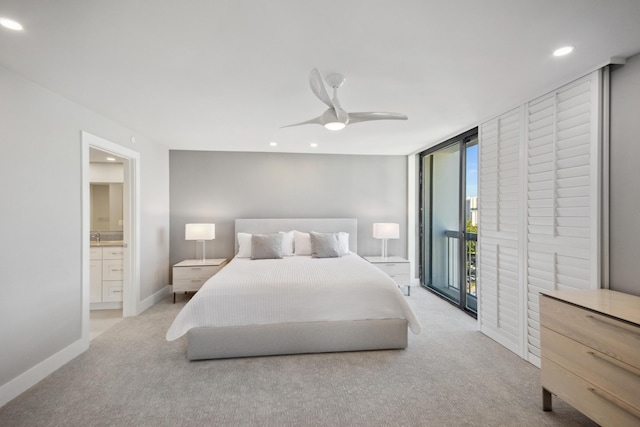 bedroom with access to outside, connected bathroom, ceiling fan, and light colored carpet