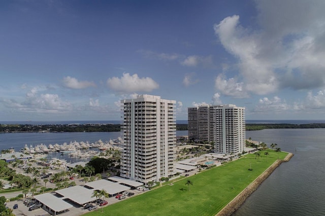 birds eye view of property with a water view