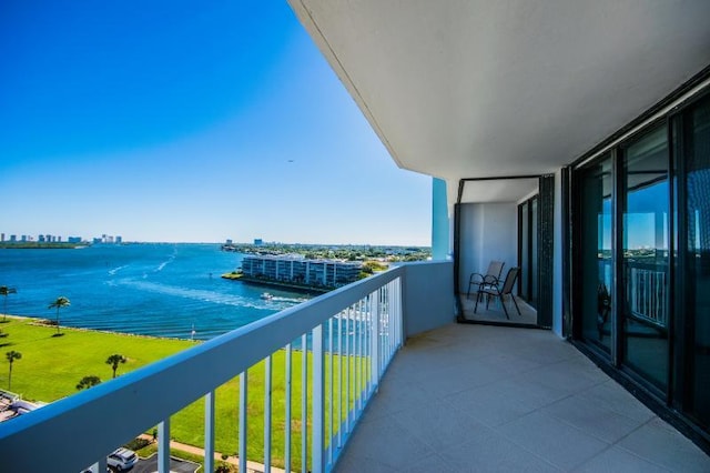 balcony featuring a water view