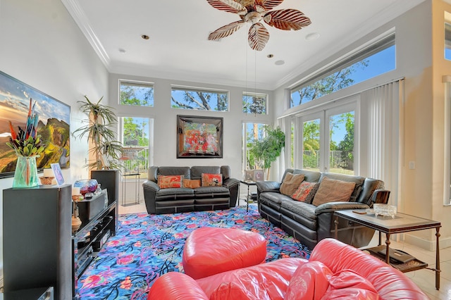 living room featuring a towering ceiling, crown molding, tile patterned flooring, and ceiling fan