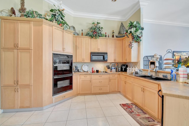 kitchen with crown molding, light brown cabinets, light tile patterned floors, and black appliances