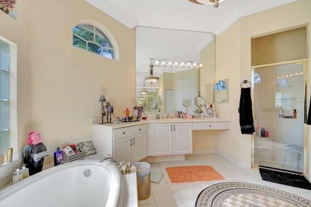 bathroom featuring plus walk in shower, vanity, tile patterned flooring, and crown molding