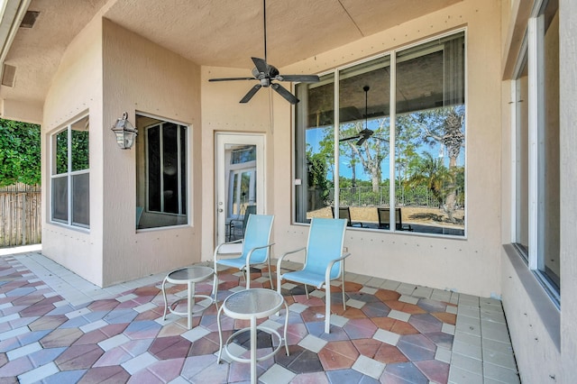 view of patio featuring ceiling fan