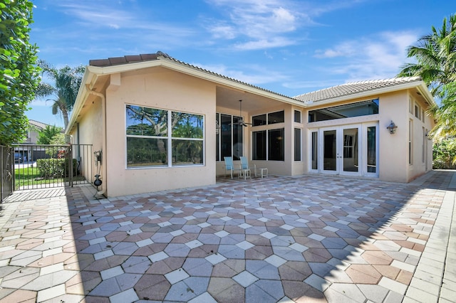 back of house featuring a patio and french doors