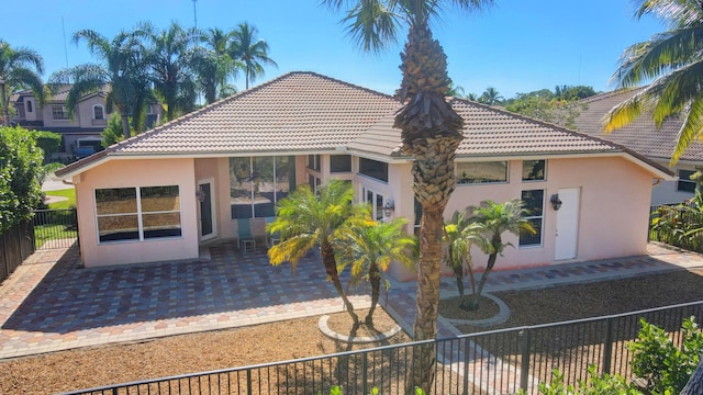 back of property with a patio