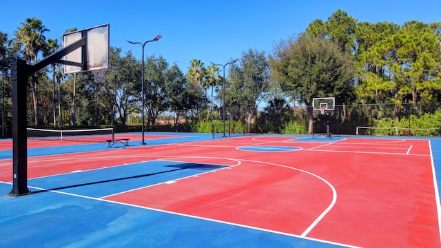 view of sport court featuring tennis court