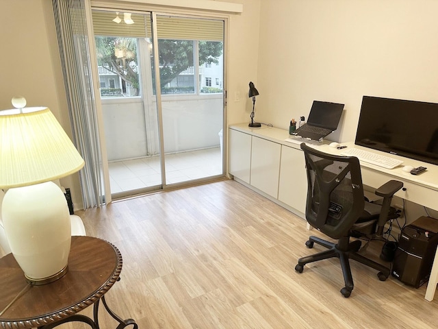 office with light hardwood / wood-style flooring