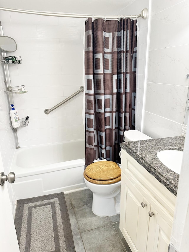 full bathroom with tile patterned flooring, shower / bath combination with curtain, vanity, and toilet