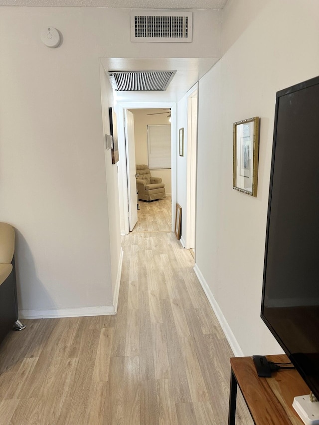 hallway featuring light hardwood / wood-style flooring