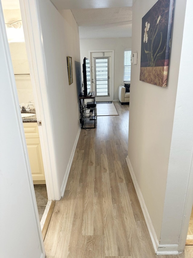 hall featuring light wood-type flooring