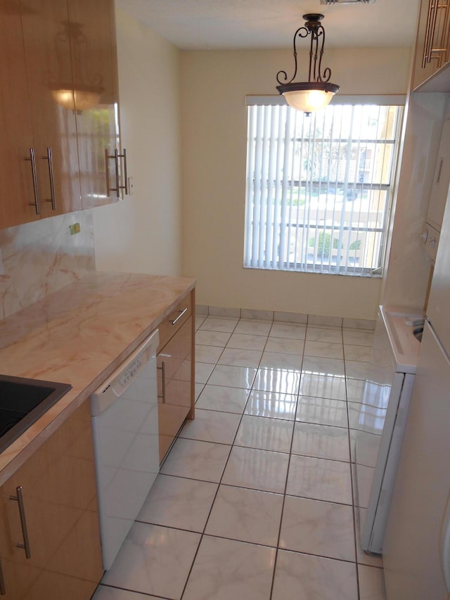 kitchen featuring dishwasher, butcher block counters, light tile patterned floors, and hanging light fixtures