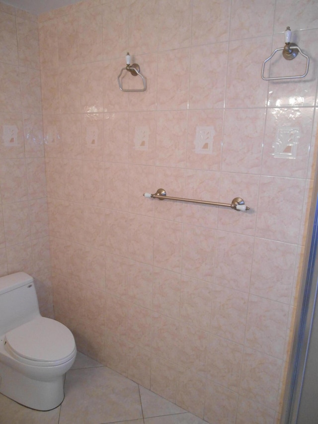 bathroom featuring tile patterned floors and toilet