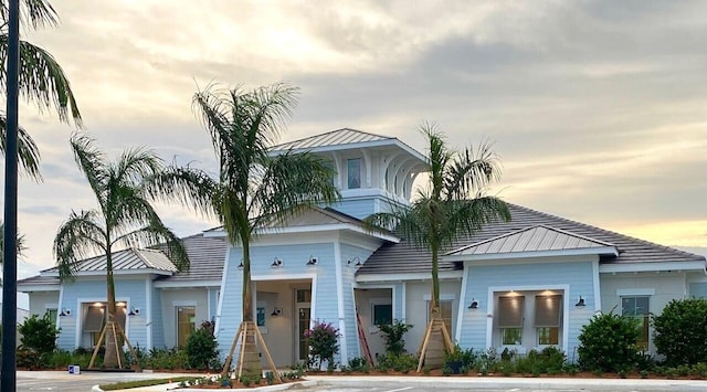 view of front of house with metal roof and a standing seam roof