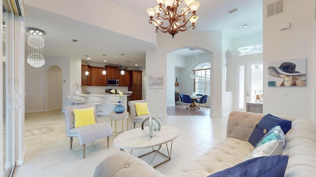 tiled living room featuring a chandelier