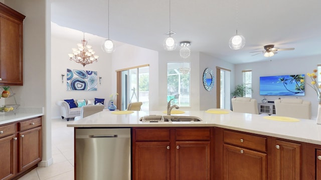 kitchen with ceiling fan with notable chandelier, sink, light tile patterned floors, decorative light fixtures, and dishwasher