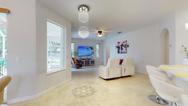 tiled living room featuring ceiling fan