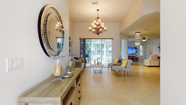 interior space featuring light tile patterned floors and a notable chandelier