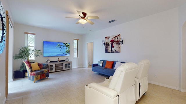 tiled living room featuring ceiling fan