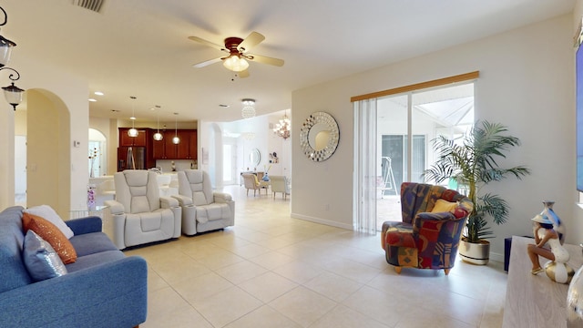 living room featuring ceiling fan and light tile patterned flooring