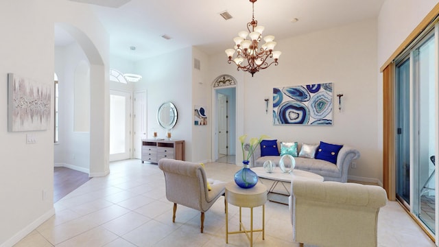 living room featuring a chandelier and light tile patterned floors